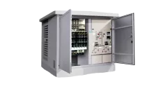 Open electrical cabinet showing switchgear and control panels inside.